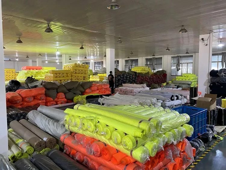 Fluorescent fabric and reflective tape rolls at Yolite factory