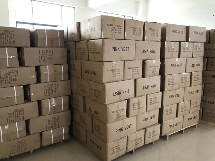 Packed cartons of custom vests ready to ship at Yolite factory